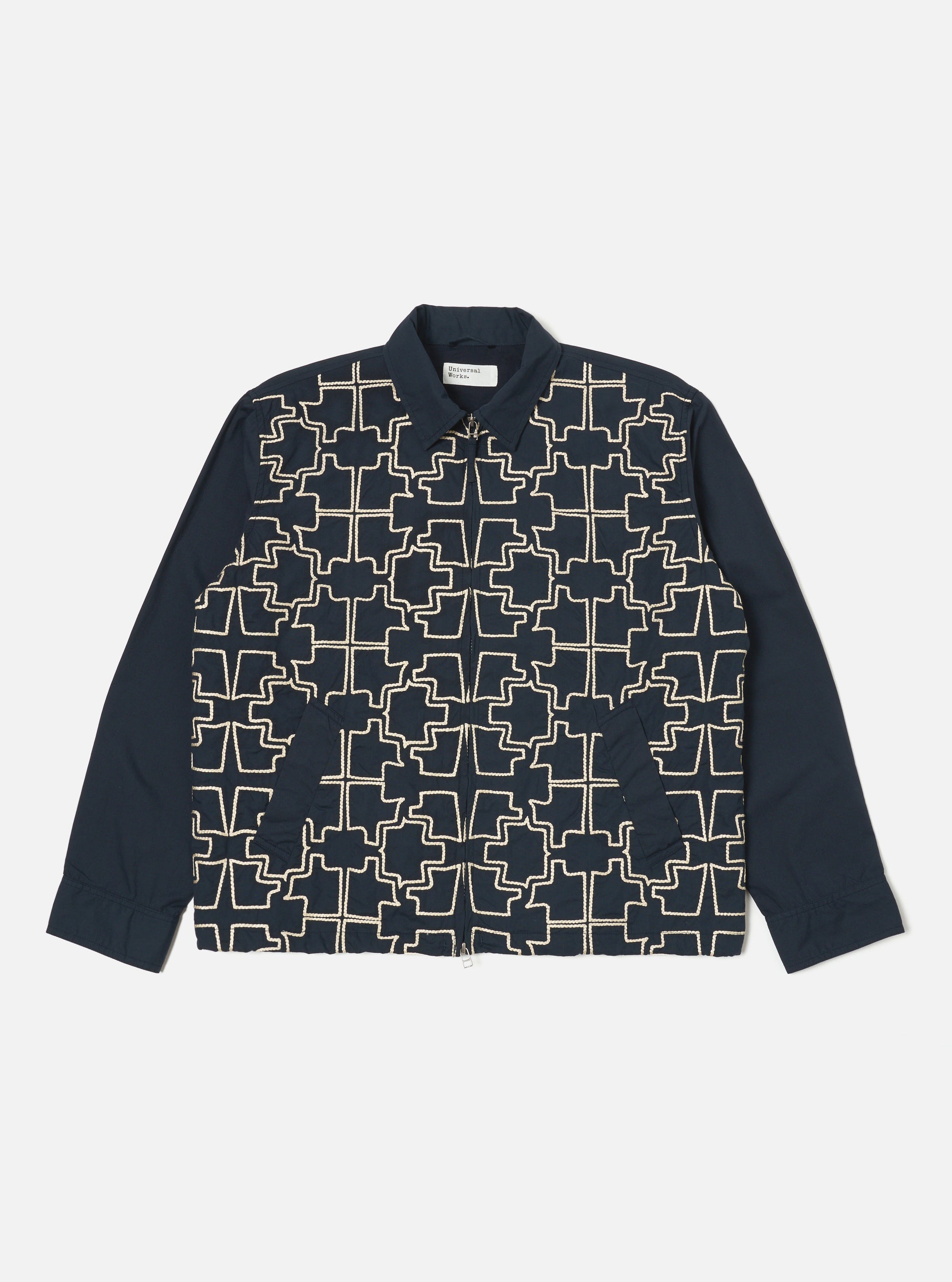 The Navy Mitla Broadcloth Club Jacket on a white background. The jacket is navy with a white geometric pattern on the front. The sleeves are plain navy.
