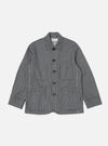 The Indigo Hickory Stripe Denim Original Bakers Jacket is laid flat on a white background. The jacket is blue and white striped denim with brown buttons.