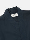 Close-up of the Navy Broadcloth Osaka Work Jacket on a white background. The jacket is broadcloth and features a collar and blue stitching.