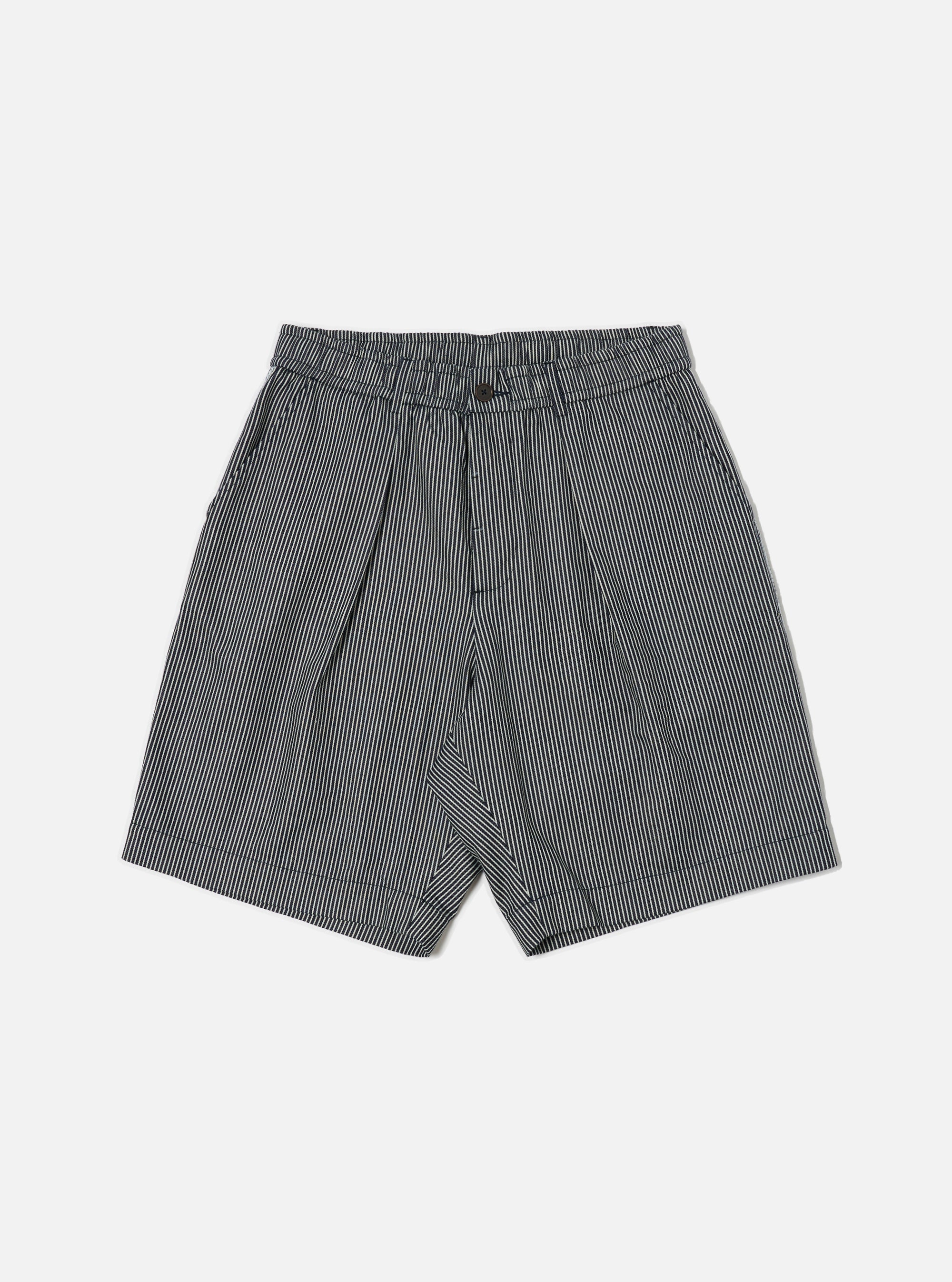 The Indigo Hickory Stripe Denim Pleated Track Short is displayed on a white background. The shorts are pleated and made of denim with indigo and white stripes.