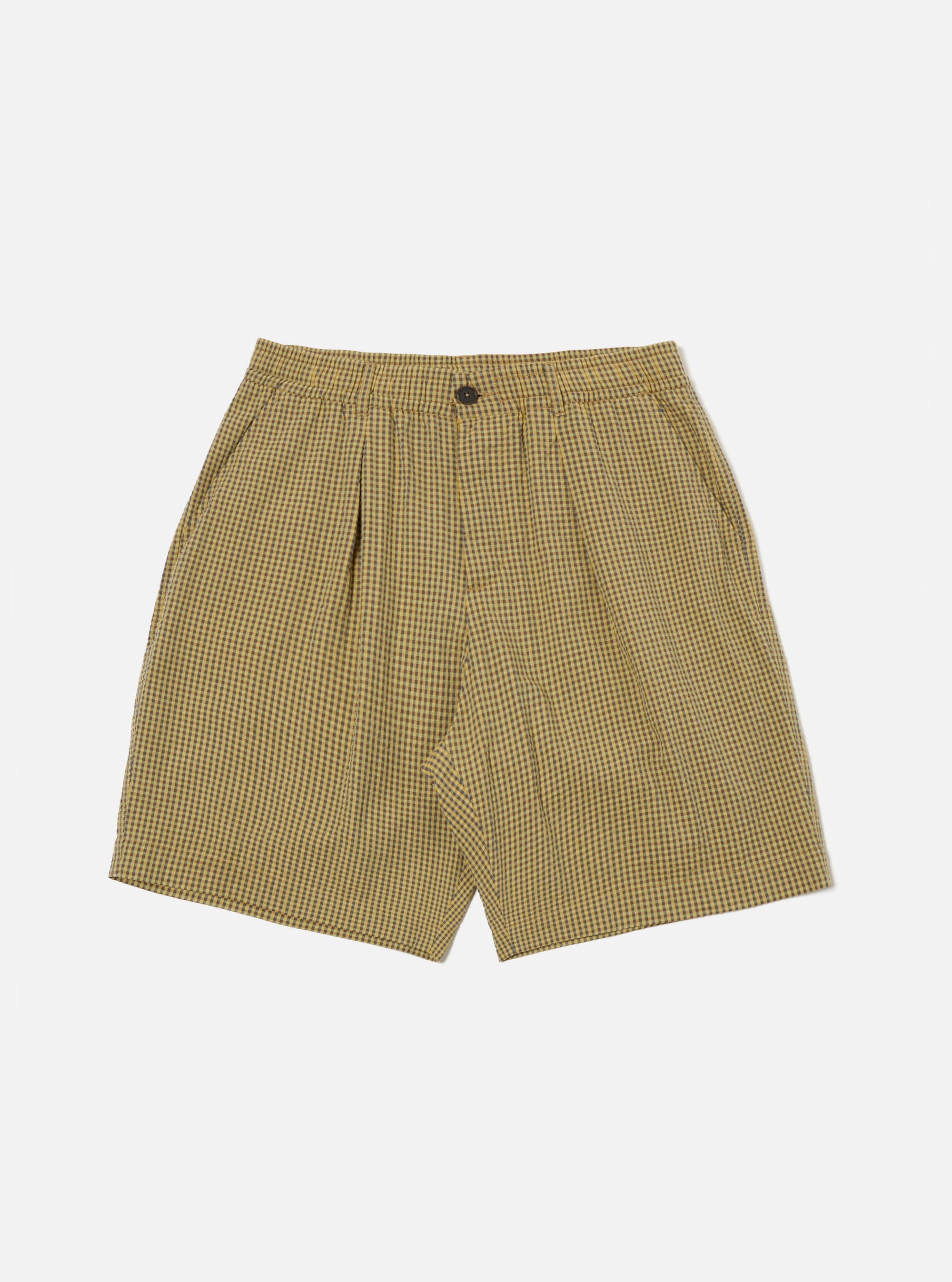 Flat lay of Yellow Japanese Seersucker Pleated Track Short on a white background. The shorts have a yellow and dark gray checkered pattern and a relaxed fit.