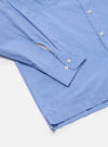 Close-up of the Blue End On End Cotton Garage Shirt on a white background. Shows the light blue cotton fabric, button details, and sleeve cuff.