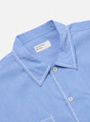 Close up of the Blue End On End Cotton Utility SS Shirt on a white background. The shirt is light blue with white stitching.
