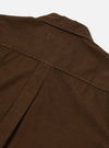 Close-up of the brown Khaki Summer Cord Tech Overshirt collar and back yoke, showing the corduroy texture against a plain white background.