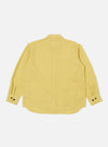Back view of the Lemon Linen Cotton Shirting Travail Overshirt on a white background. The shirt is a light yellow color and has long sleeves with buttoned cuffs.