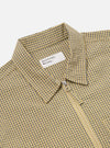 Close-up of the Yellow Japanese Seersucker Zip Uniform Jacket, showcasing its yellow and grey checkered pattern, seersucker texture, and zip closure. The jacket is displayed on a flat surface.