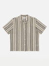 The Charcoal Cotton Lattice Road Shirt is laid flat on a white background. The shirt has a charcoal and beige lattice pattern.
