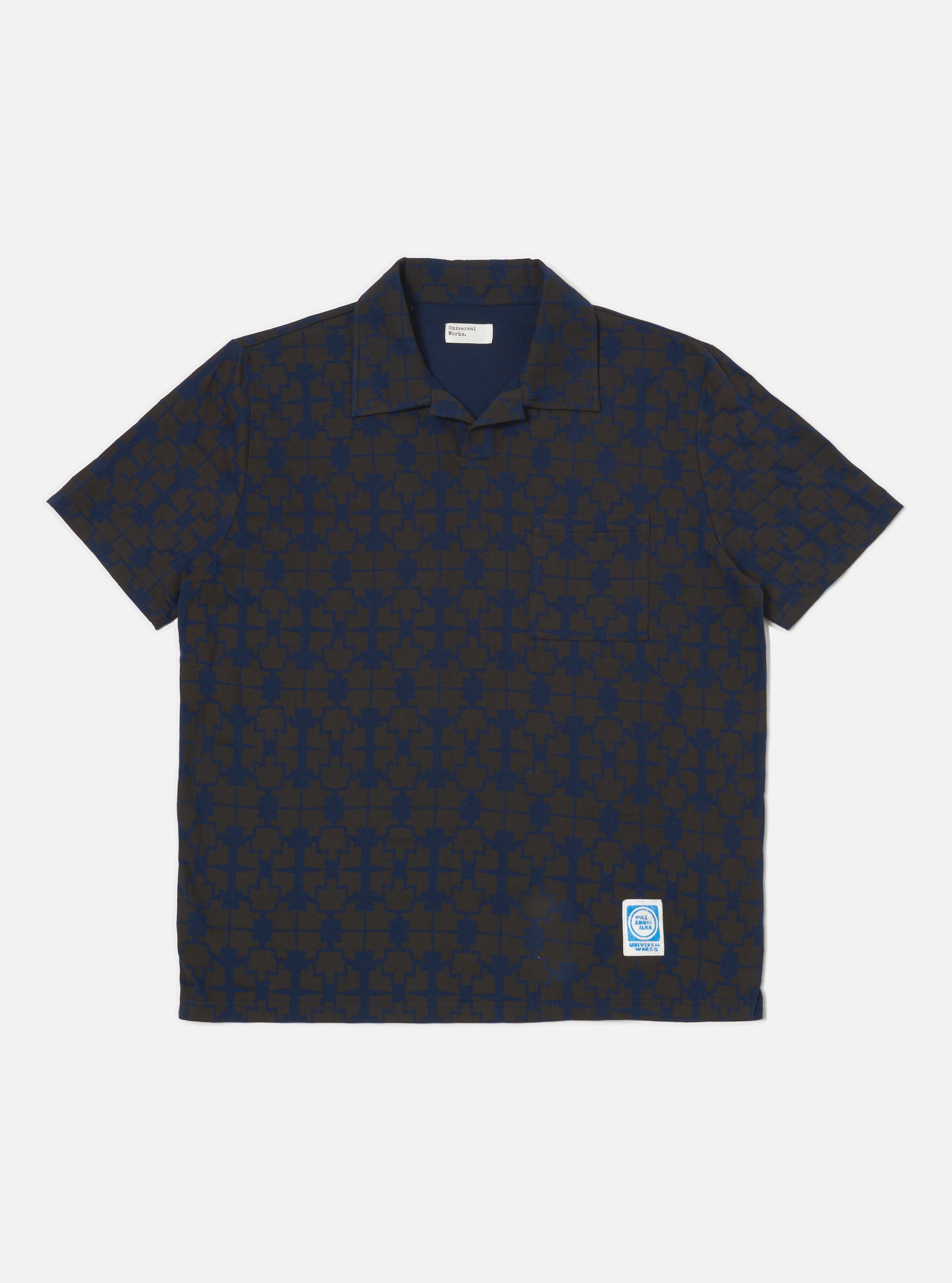 The Navy/Brown Mitla Print Jersey Newlyn Polo on a white background. The polo features a navy and brown geometric print and short sleeves.