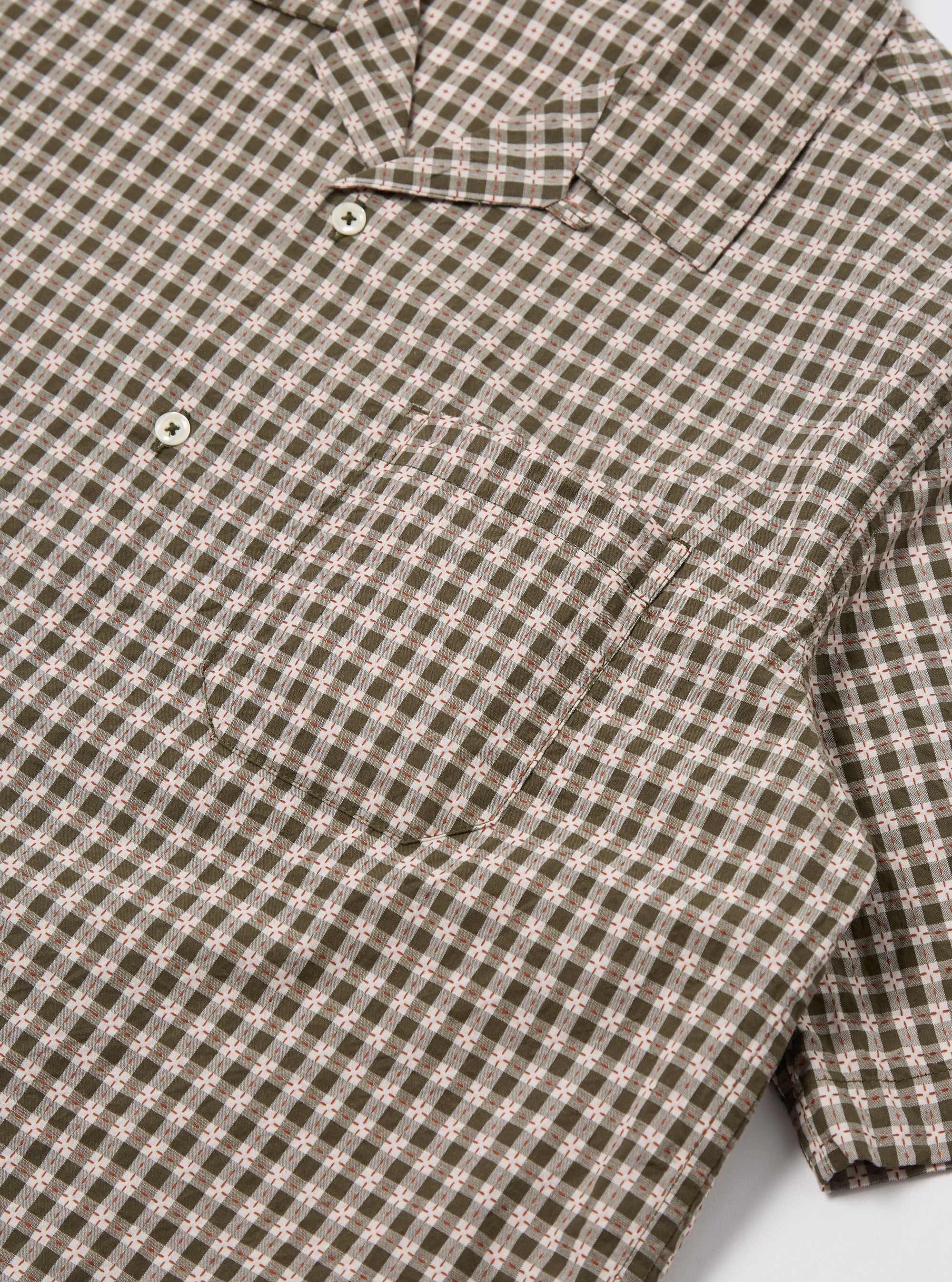 Close-up of the Olive Dobby Check Road Shirt, featuring a green and white checkered pattern with short sleeves. The shirt is laid flat on a white surface.