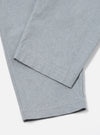 Close-up of the Indigo Reworked Jean Cloth Oxford Pant in light blue on a white background. The fabric has a subtle texture.