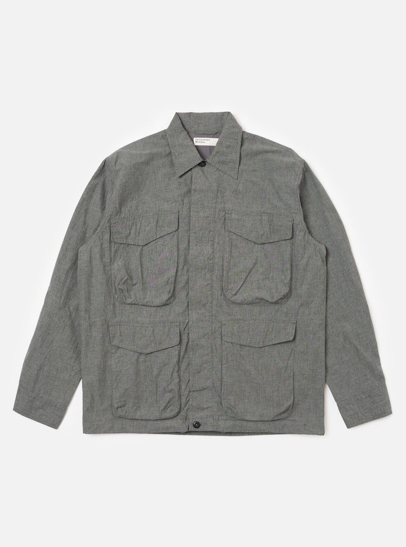 The Charcoal Organic Chambray Parachute Field Jacket is laid flat on a white background. The jacket is a light charcoal color and has four front pockets.