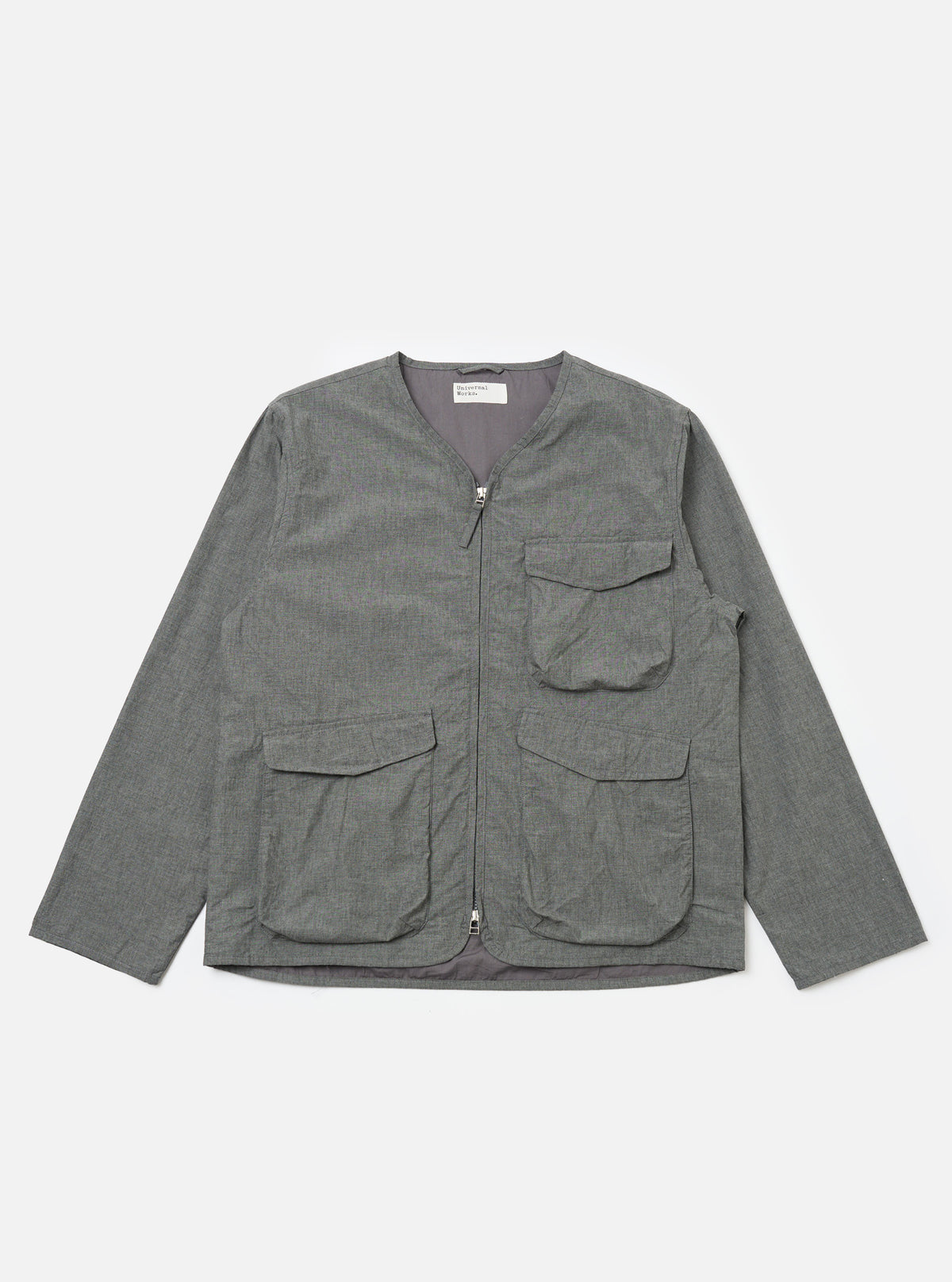 The Charcoal Organic Chambray Parachute Liner Jacket in charcoal gray, laid flat on a white background. The jacket has a zip front and four pockets.