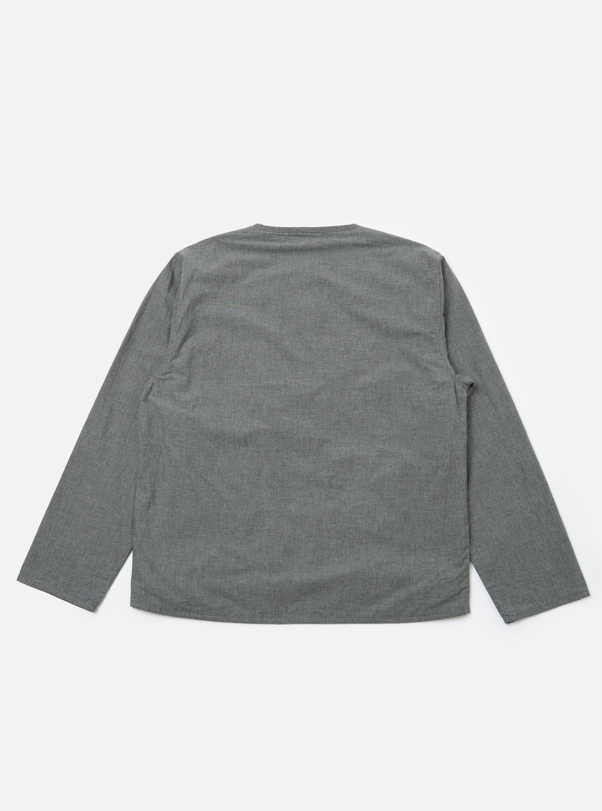 The Charcoal Organic Chambray Parachute Liner Jacket in charcoal gray, laid flat on a white background. The jacket is long-sleeved and made of a textured chambray material.
