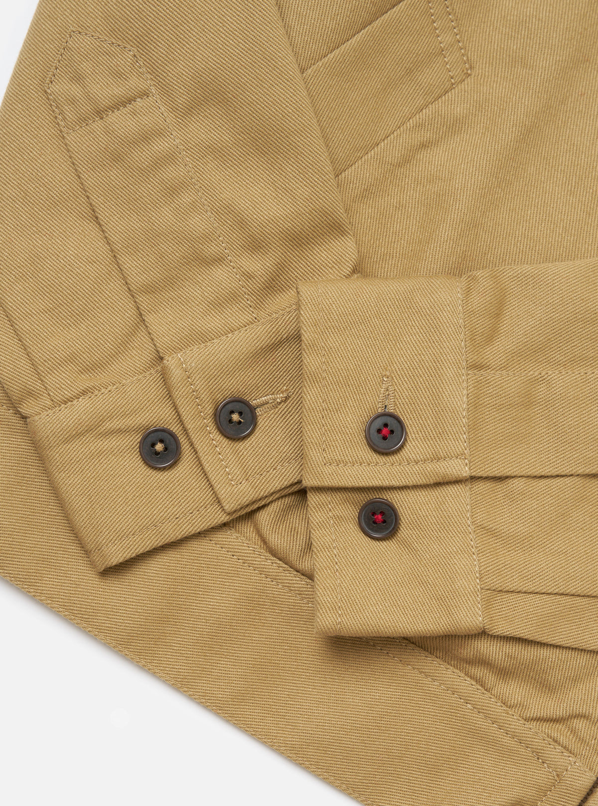 Close-up of the Khaki Works Twill Rose Bowl Jacket showing the twill fabric, button details, and seams on a white background.