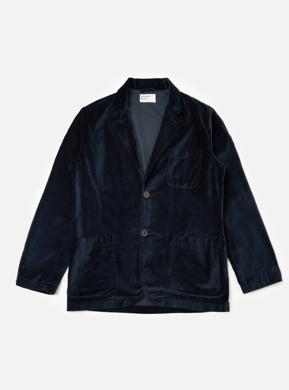The Navy Velveteen Two Button Jacket is displayed on a white background. The jacket is a rich navy color and has a classic fit with two buttons.