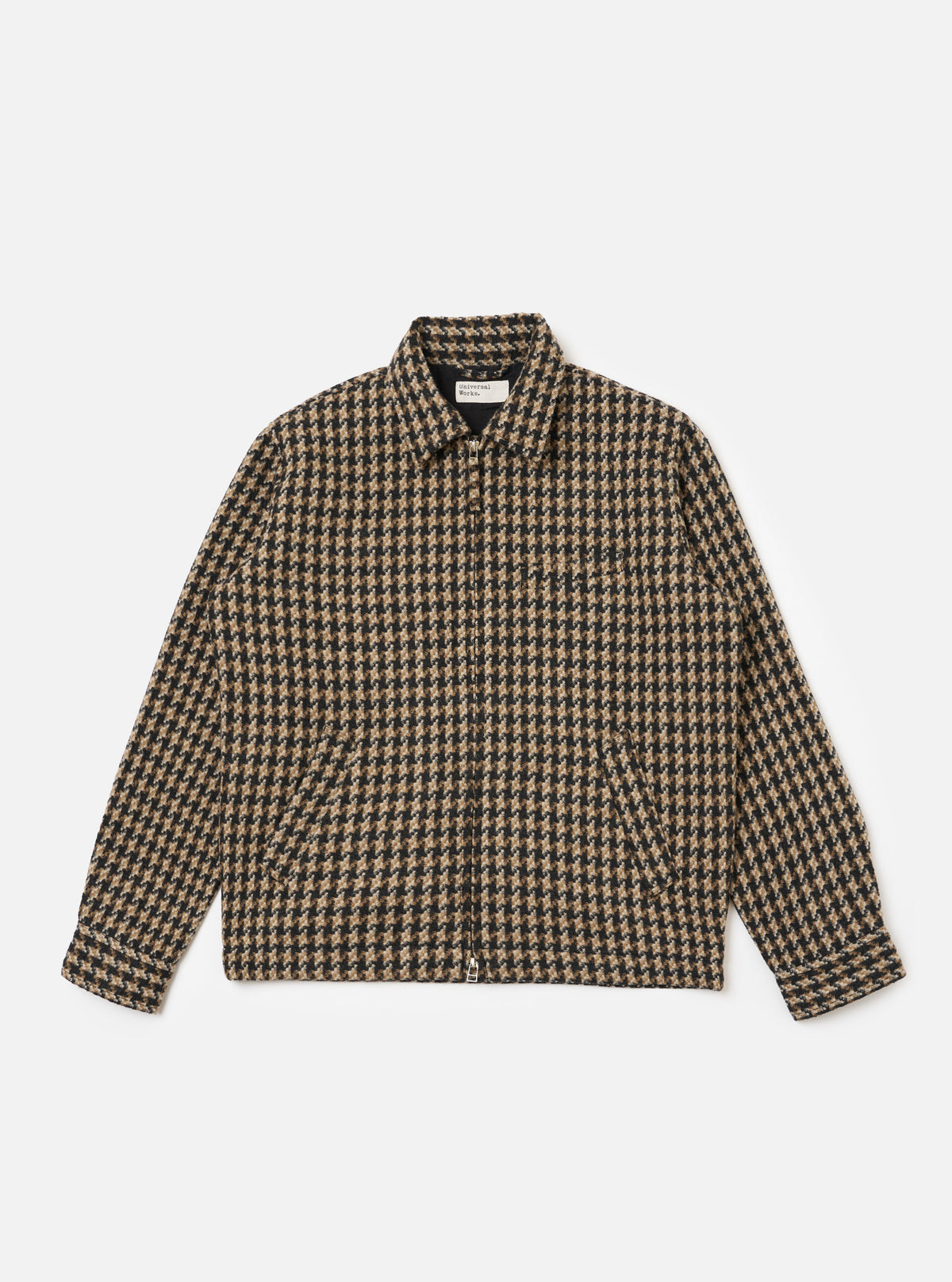 The Sand Cortina Tweed Windcheater in a brown and black tweed pattern, laid flat on a white background. The jacket is fully zipped and shows the collar.