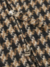 Close-up of the Sand Cortina Tweed Windcheater, showcasing the tweed material and zipper. The tweed is a mix of sand, brown, and black. 