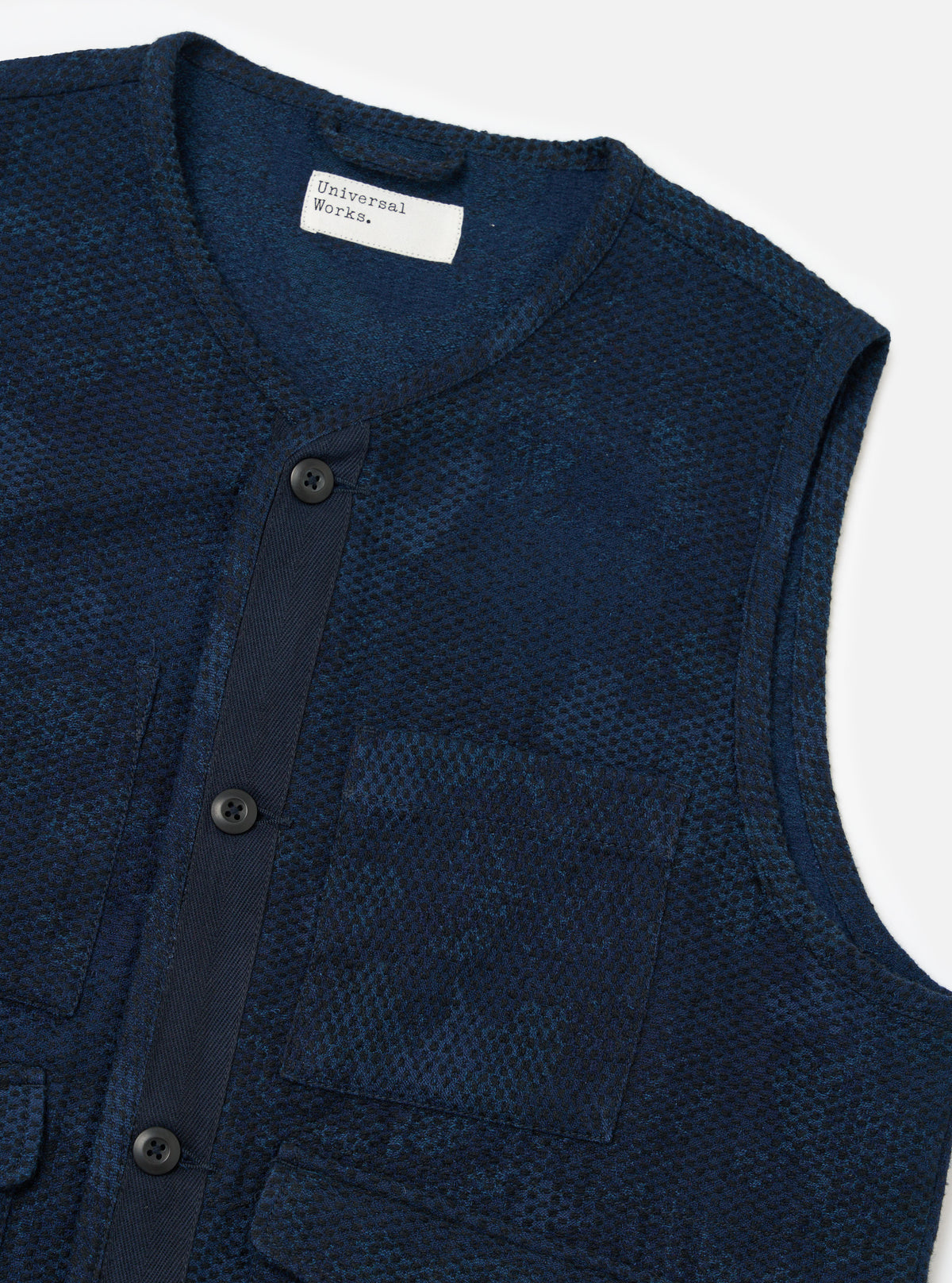 Close-up of the Black/Indigo Denim Camo 4 Pocket Gilet on a white background. The gilet features a button-up front and four pockets.