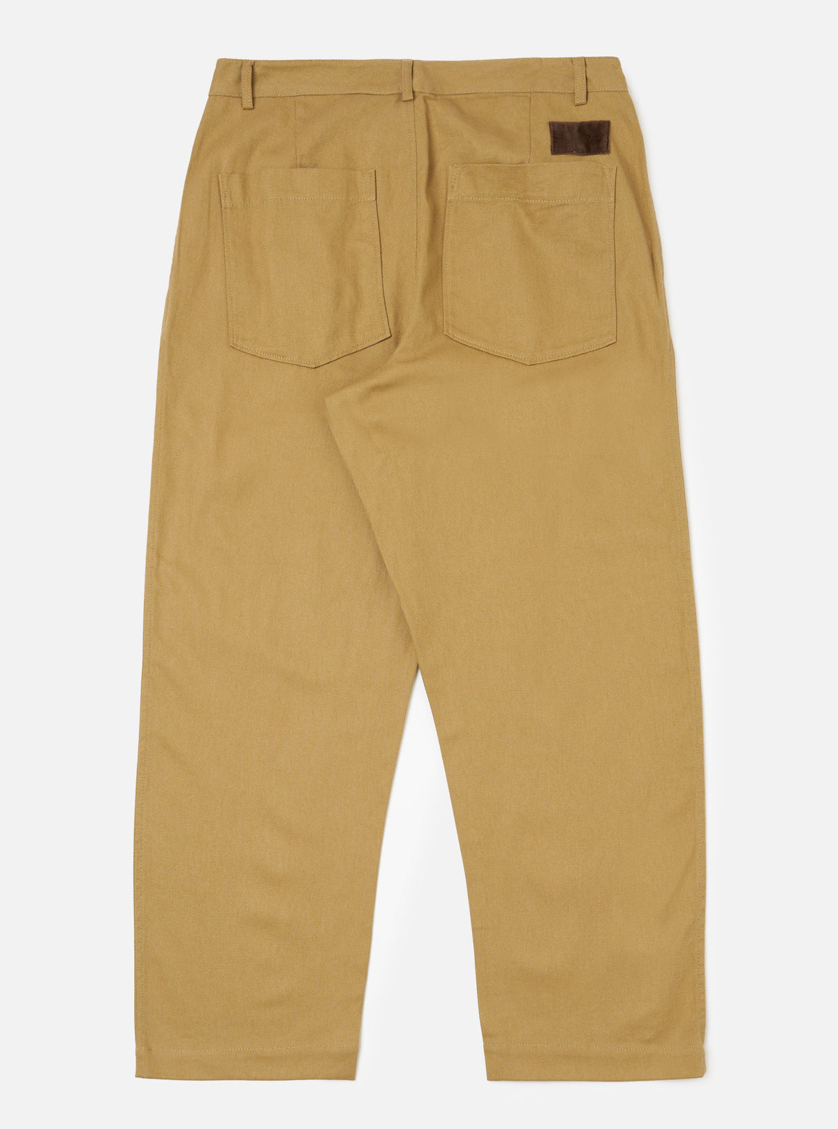 Back view of Khaki Works Twill Duke Pant on a white background. The pants are khaki-colored twill with back pockets and a brown leather patch.
