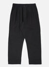 Flat lay of the Black Organic Canvas Dutch Pant on a white background. The pants are a relaxed fit and made of black canvas material.