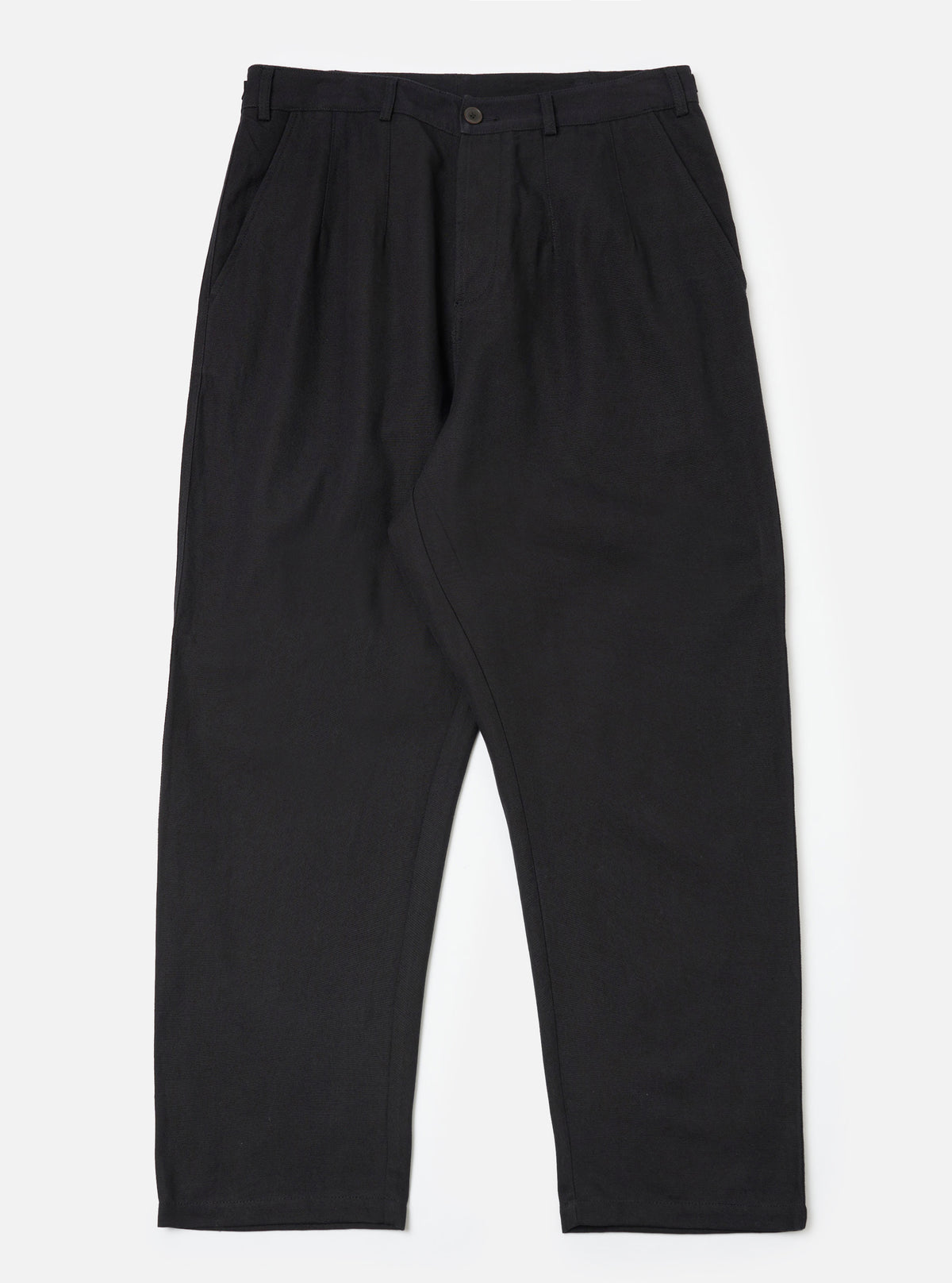 Flat lay of the Black Organic Canvas Dutch Pant on a white background. The pants are a relaxed fit and made of black canvas material.