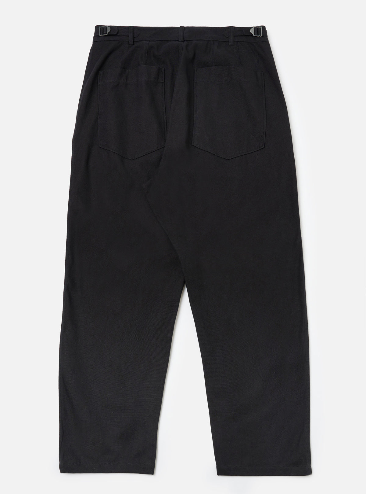 Back view of Black Organic Canvas Dutch Pant on a white background. The pants are wide-legged with belt loops and back pockets.