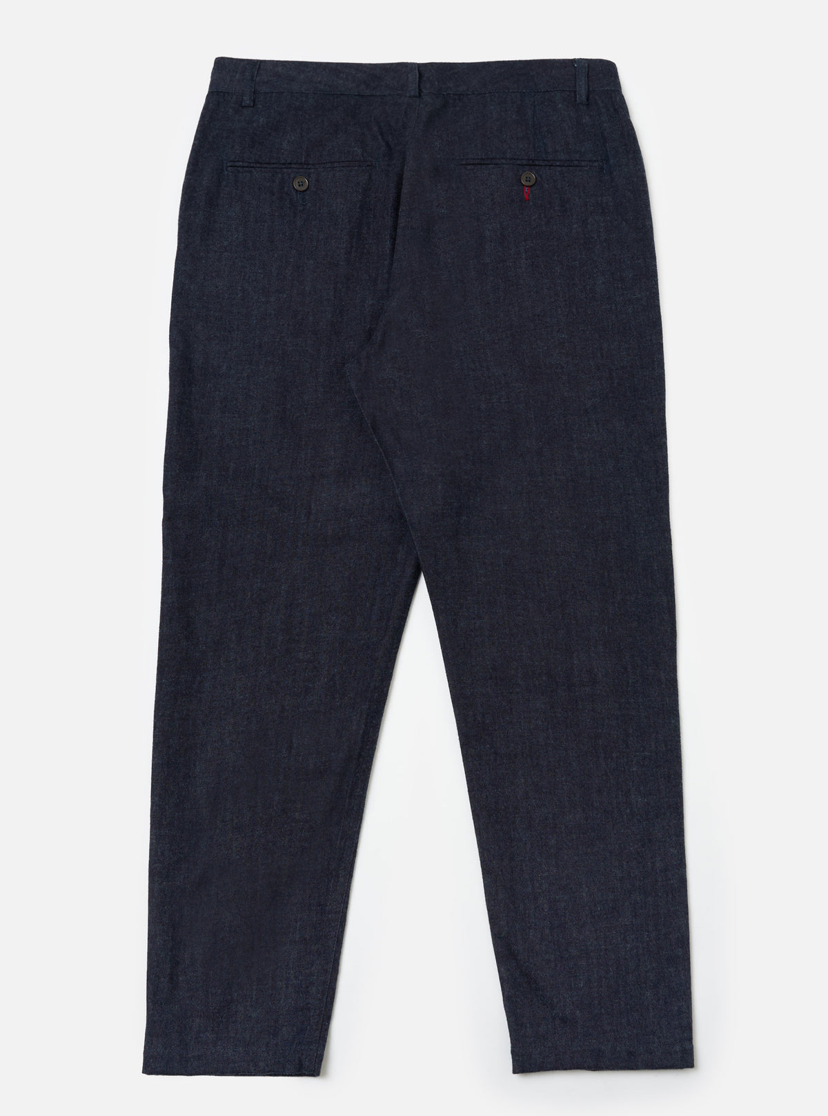 Back view of Indigo Brushed Denim Military Chino on a white background. The dark wash denim pants have a classic fit.