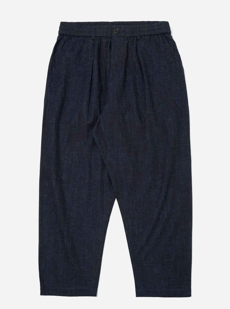 Studio shot of Indigo Brushed Denim Oxford Pant on a white background. The pants are a dark indigo color with a relaxed fit.