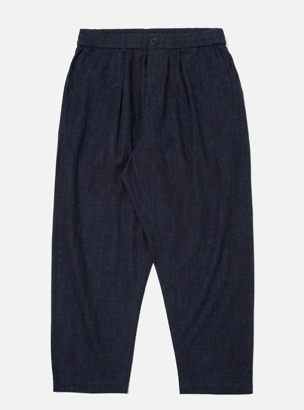 Studio shot of Indigo Brushed Denim Oxford Pant on a white background. The pants are a dark indigo color with a relaxed fit.