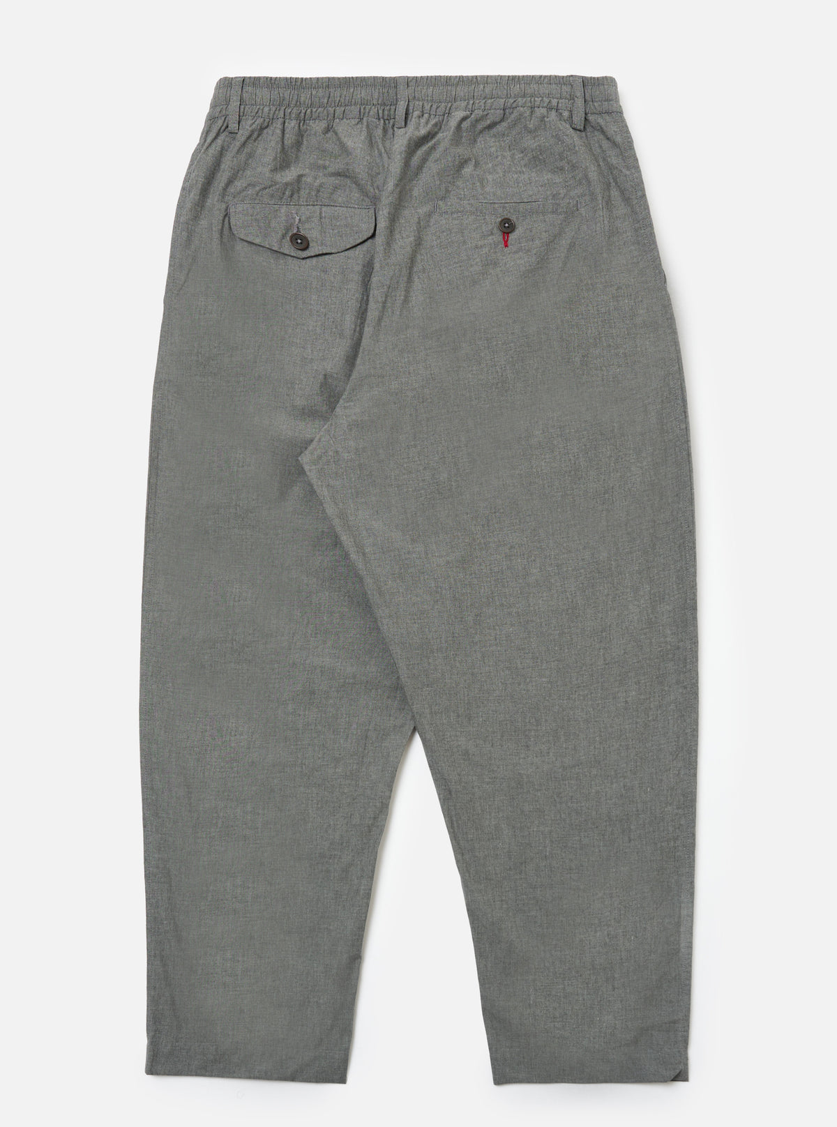 Back view of Charcoal Organic Chambray Oxford Pant on a white background. The pants are a relaxed fit with an elastic waistband and buttoned back pockets.