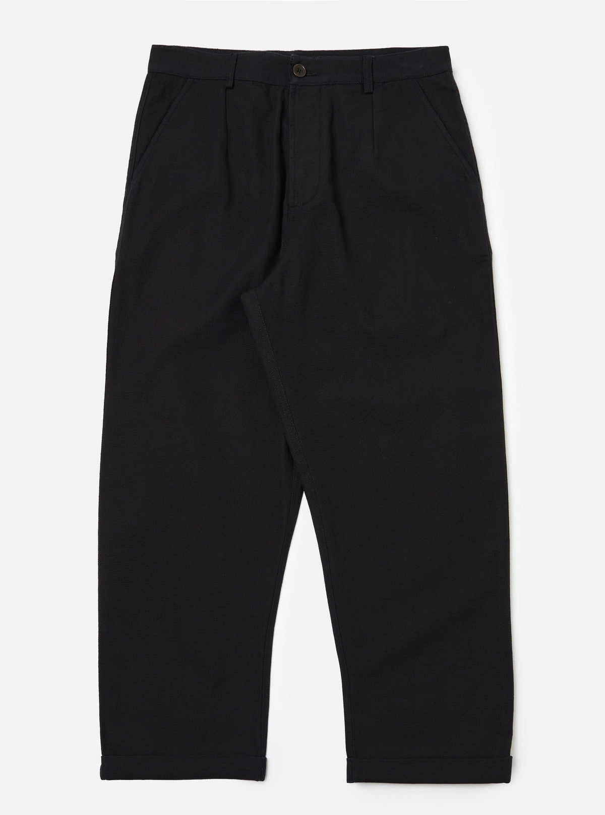 Studio shot of Black Organic Canvas Super Chino pants. The canvas material has a relaxed fit. The background is a clean, bright white.