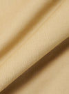 Close-up of the Sand Organic Fine Cord Fatigue Shirt fabric. The fine corduroy texture is visible in a soft, neutral sand color. The fabric is draped to show its texture.