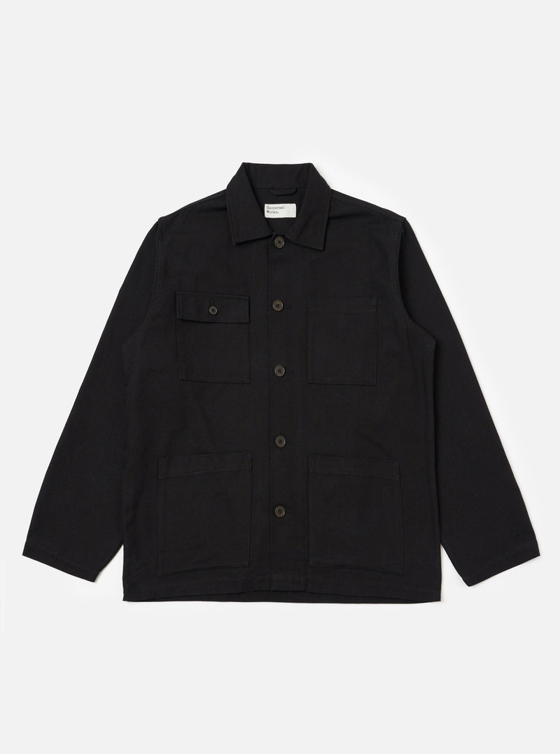The Black Organic Canvas Dockside Overshirt is laid flat on a white background. The overshirt has a collared neck, button closure, and four pockets.