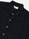 Close-up of the Black Organic Fine Cord Daybrook Shirt on a white background. The shirt features a button-down style with a chest pocket.