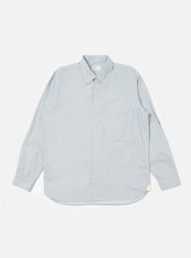 The Sky Blue Brushed Organic Cotton Square Pocket Shirt, laid flat on a white background. The shirt is light blue, long-sleeved, and has a square pocket.
