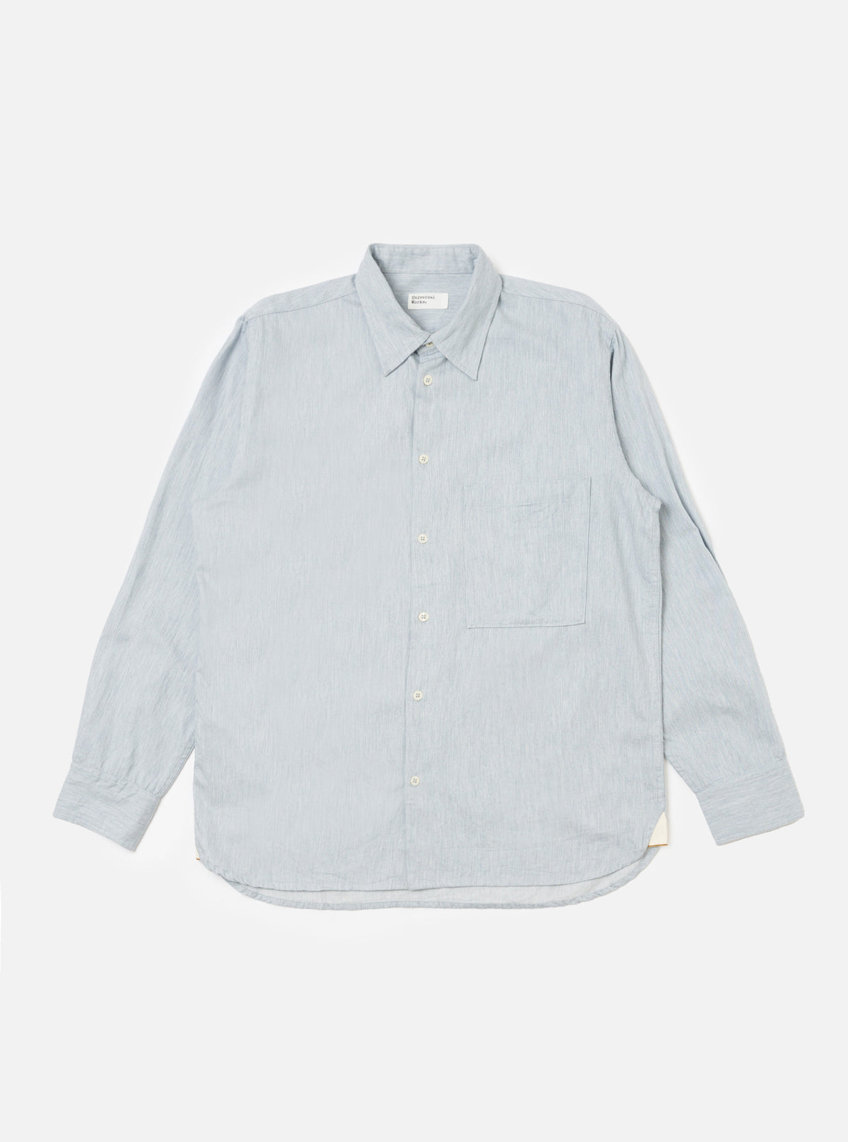The Sky Blue Brushed Organic Cotton Square Pocket Shirt, laid flat on a white background. The shirt is light blue, long-sleeved, and has a square pocket.