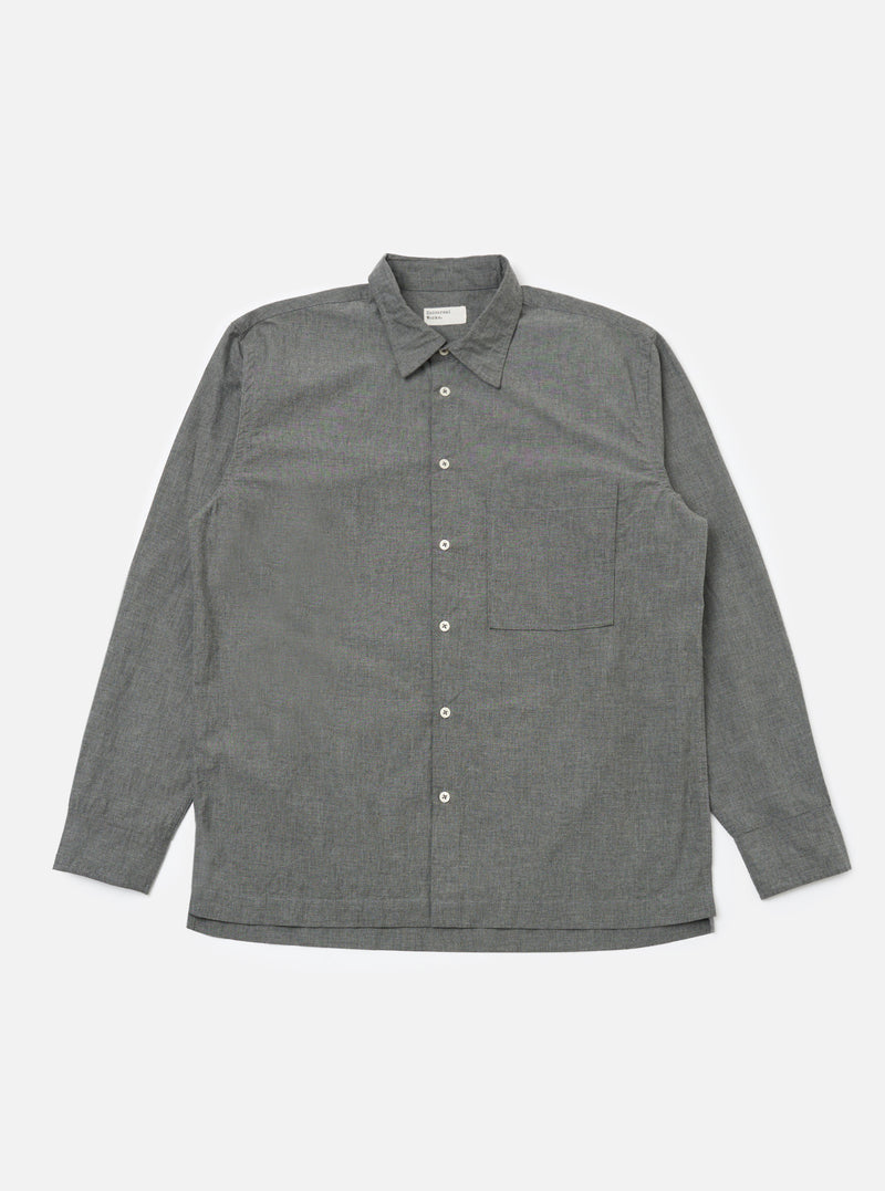 The Charcoal Organic Chambray Lucky Shirt, laid flat on a white background. The long-sleeved shirt is gray with white buttons and a chest pocket.