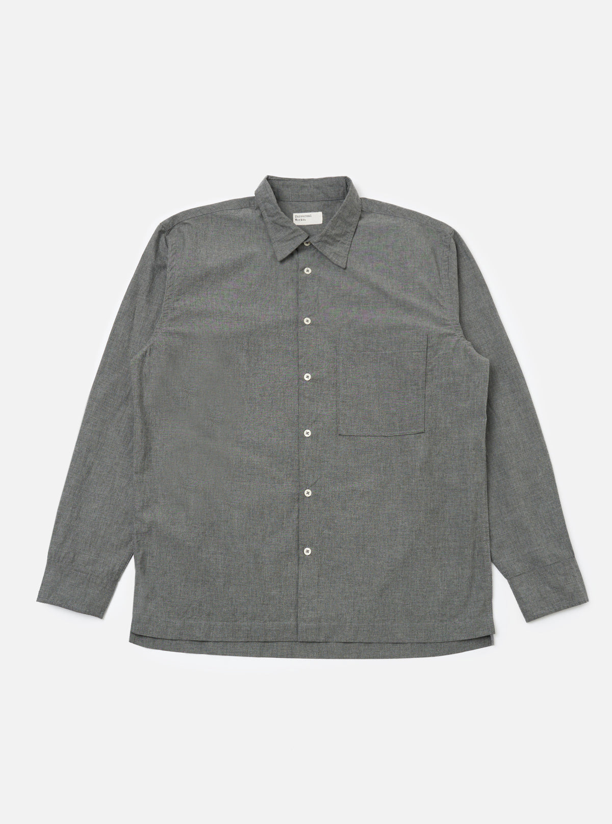 The Charcoal Organic Chambray Lucky Shirt, laid flat on a white background. The long-sleeved shirt is gray with white buttons and a chest pocket.