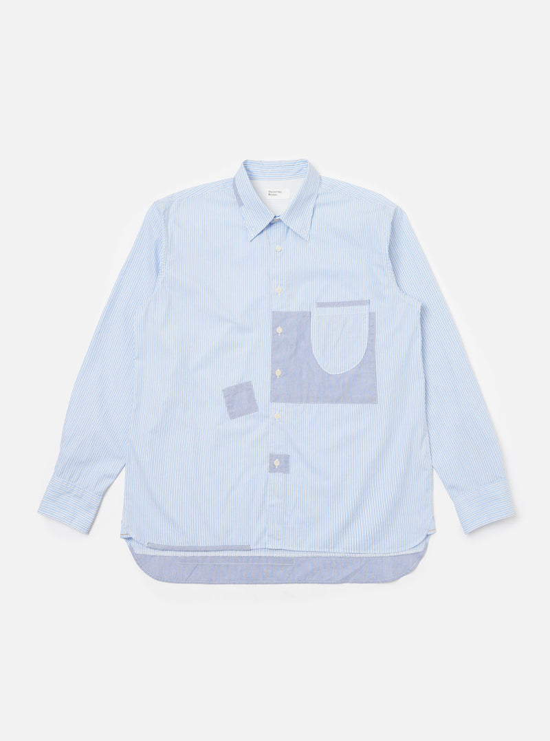 The Blue Office Stripe Patched Lazy Day Shirt is laid flat on a white background. It features light blue stripes and patched details.