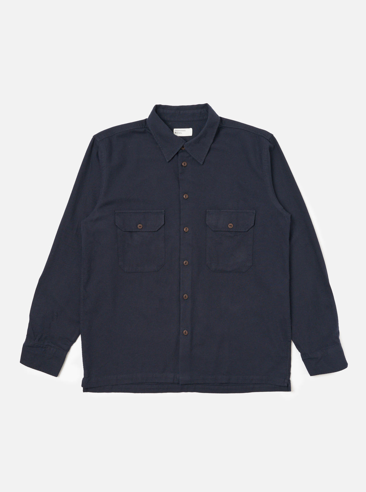 The dark navy Sid Flannel CPO Shirt, a long-sleeved button-down with two chest pockets, is laid flat on a white background. The shirt has brown buttons and a classic fit.