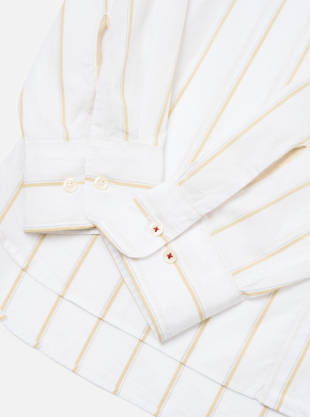 Close-up of the White Office Stripe Square Pocket Shirt on a white surface. The shirt has gold and blue stripes and white buttons.