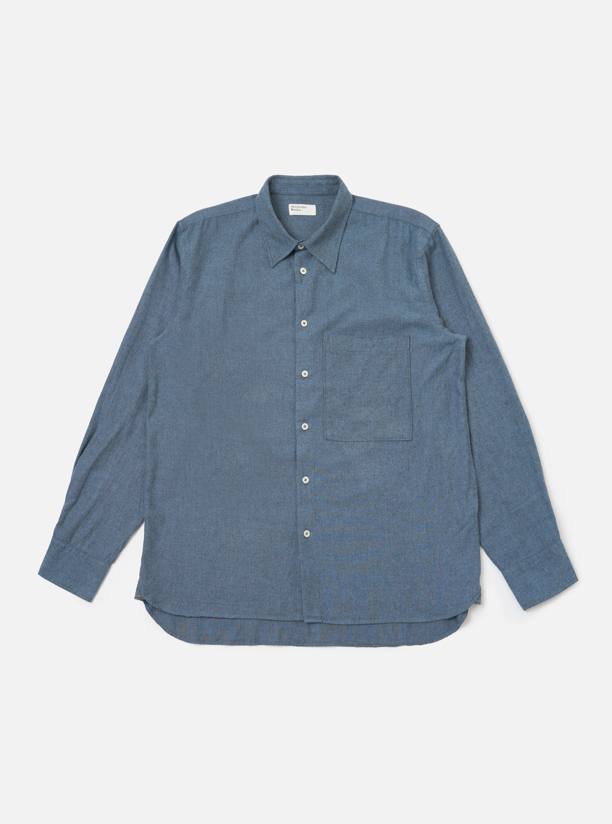 The Blue Brushed Marl Twill Square Pocket Shirt is laid flat on a white background. The shirt is a brushed blue twill with a square pocket.