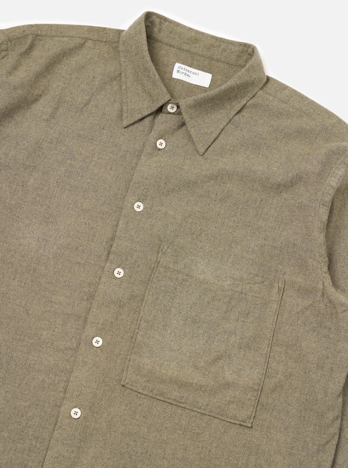Close-up of the Mustard Brushed Marl Twill Square Pocket Shirt on a white background. The shirt is a textured twill with a square pocket and white buttons.
