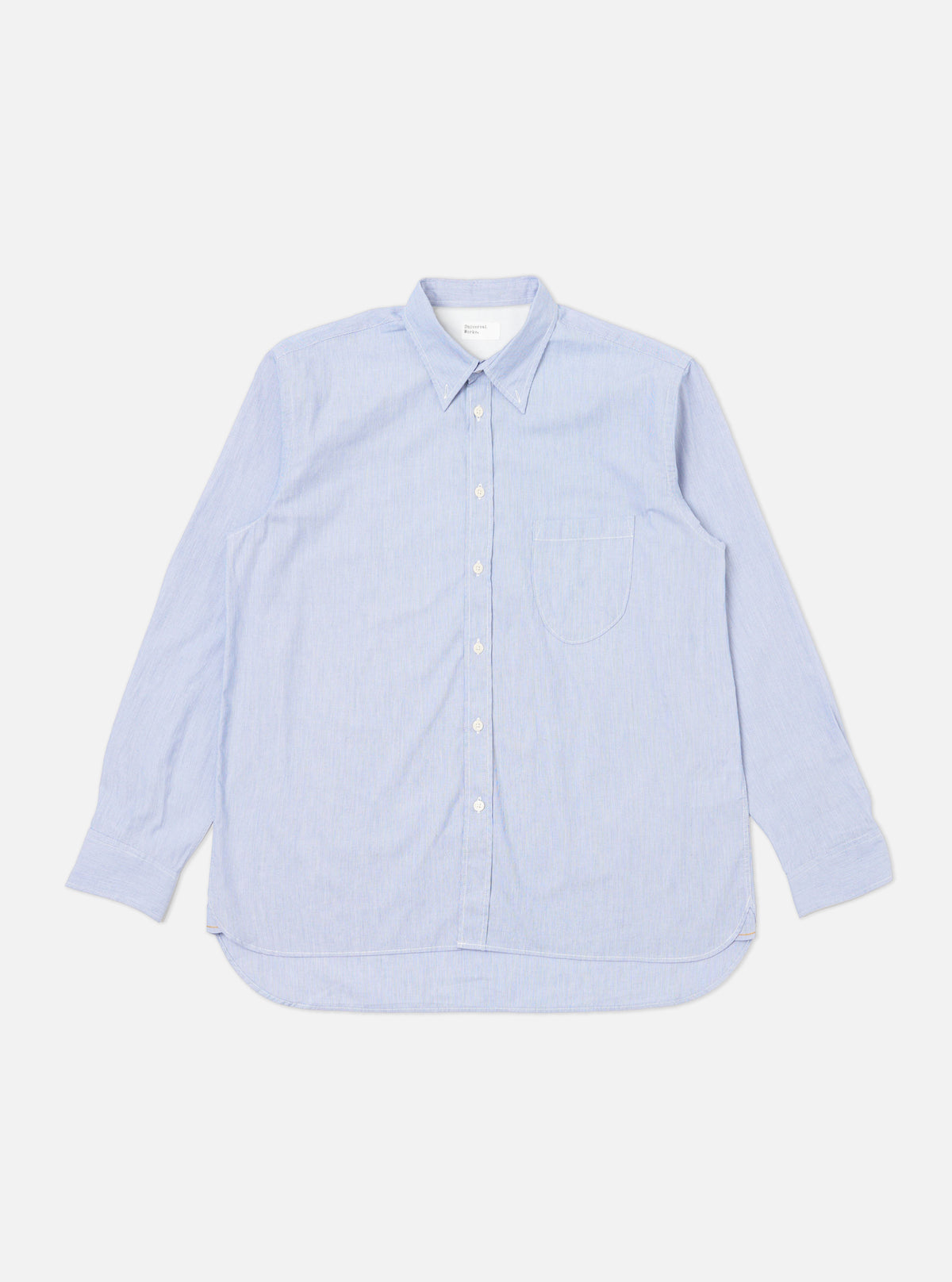 The Blue Classic Stripe Lazy Day Shirt is laid flat on a white background. The shirt is light blue with thin white stripes and has a relaxed fit.