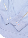 Close-up of the Blue Classic Stripe Lazy Day Shirt on a white surface, showing the cuff, buttons, and striped pattern.