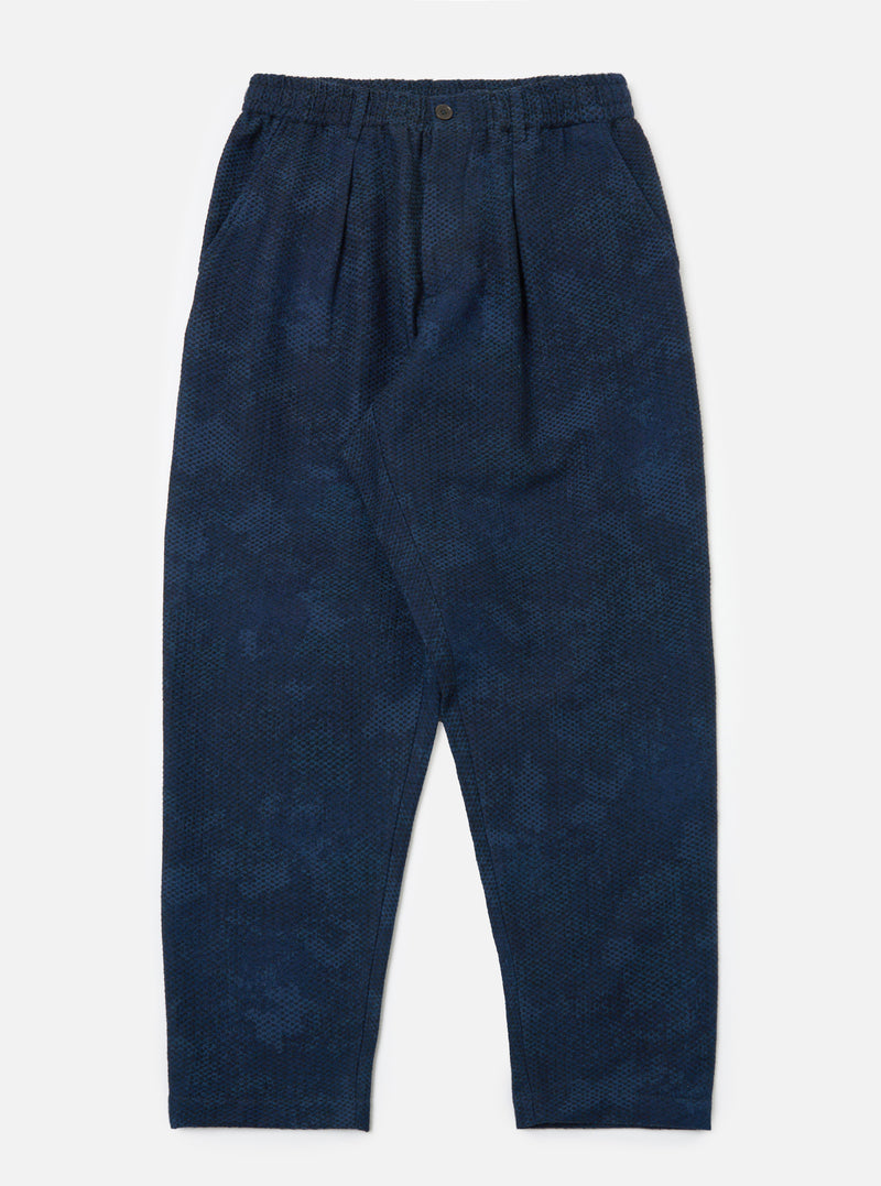 Studio shot of the Black/Indigo Denim Camo Pleated Track Pant on a white background. The pants have a relaxed fit and a subtle camo pattern.