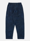 Studio shot of the Black/Indigo Denim Camo Pleated Track Pant on a white background. The pants have a relaxed fit and a subtle camo pattern.