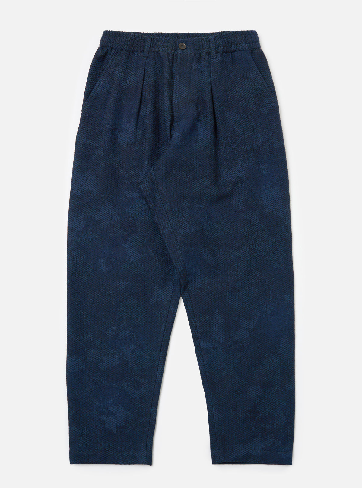 Studio shot of the Black/Indigo Denim Camo Pleated Track Pant on a white background. The pants have a relaxed fit and a subtle camo pattern.