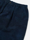 Close-up of the Black/Indigo Denim Camo Pleated Track Pant on a white background. Shows the texture and pleats of the denim.