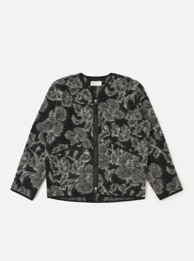 The Charcoal Flower Fleece Zip Liner Jacket is displayed on a white background. The jacket is black and gray with a floral pattern and a full zipper.
